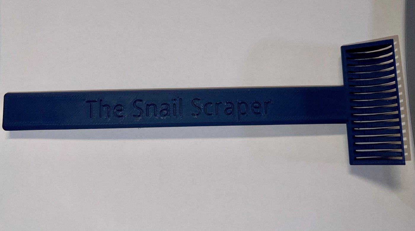 Garry's Snail Scraper: a blue 3D-printed scraper with a long handle and a comb-style head